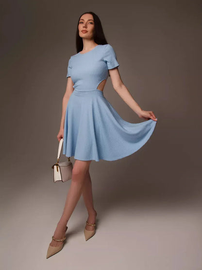 Model in a light blue mini dress with cut-out waist, perfect for summer and various occasions like weddings and parties.