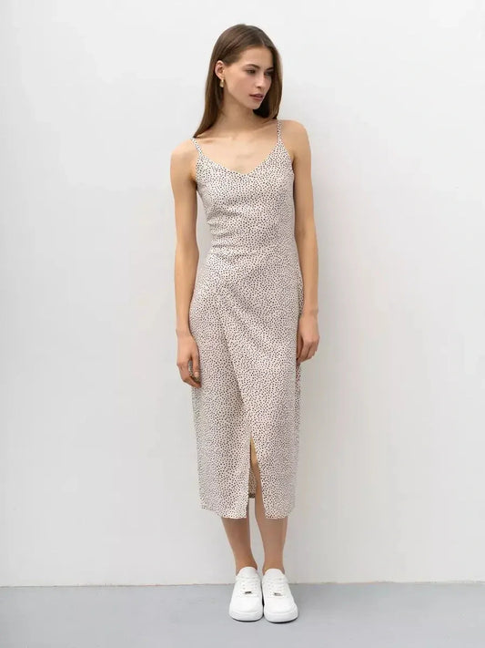 Model wearing the lightweight Dot Whisper Midi Dress with playful polka dot print, perfect for summer and casual occasions.