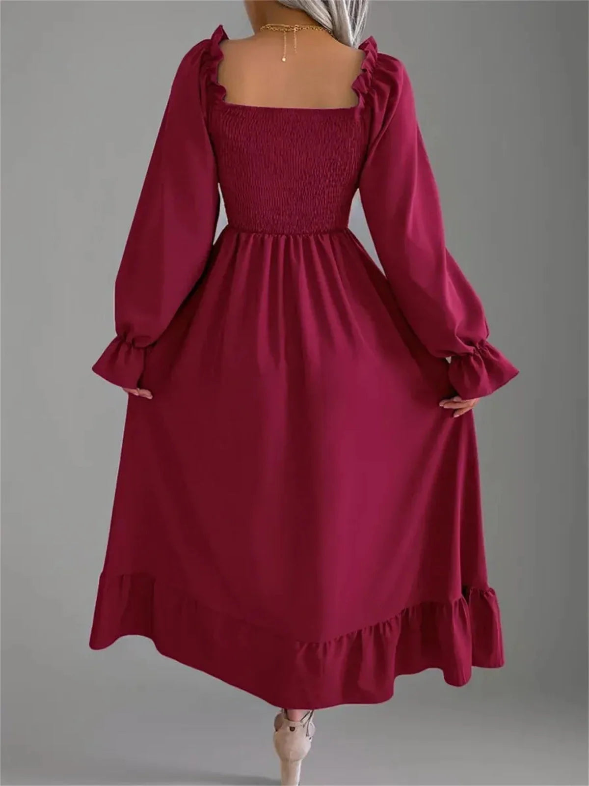 Back view of the Velina Midi Dress in burgundy, featuring a square neck and ruffled hemline, perfect for summer events and formal occasions.