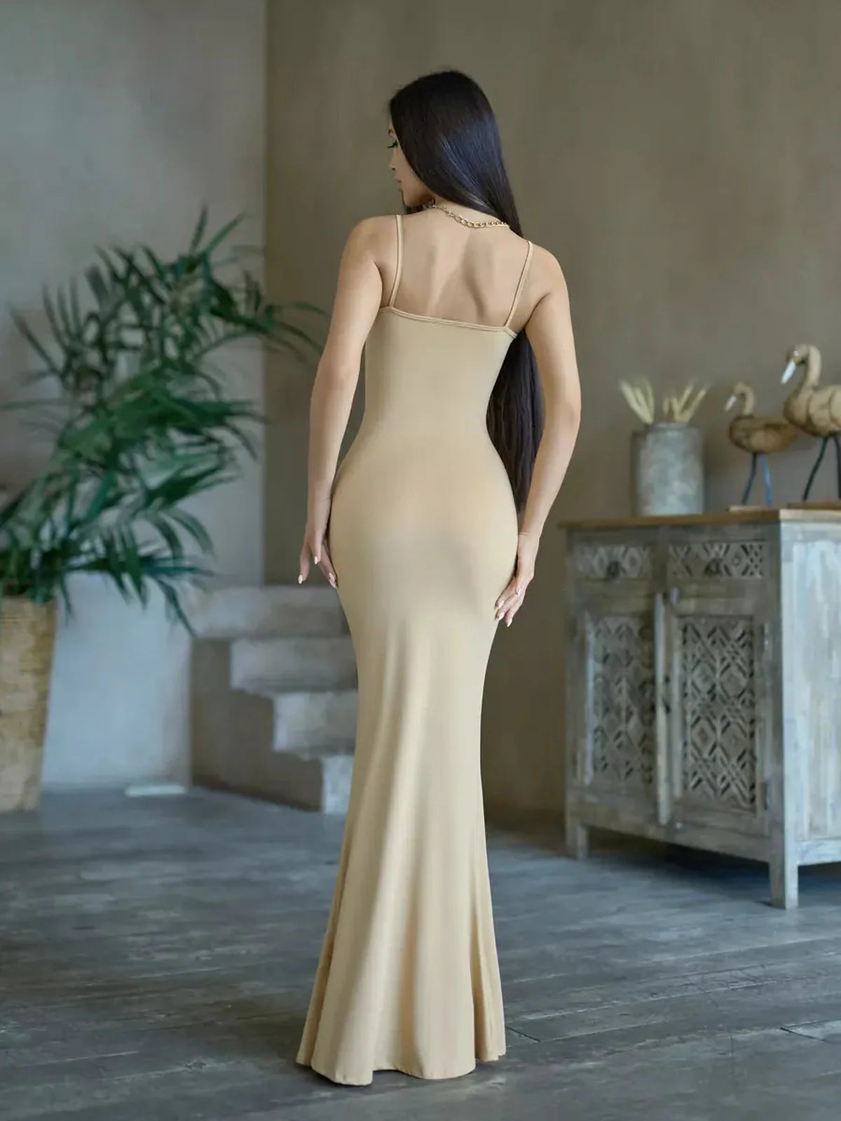 Back view of the Sculpted Elegance Maxi Dress showcasing its body-hugging fit and sleek minimalist design.