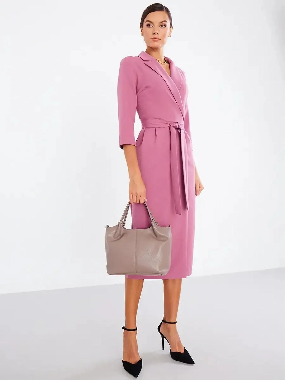 Elegant blush wrap midi dress with belted waist, perfect for weddings or formal occasions.