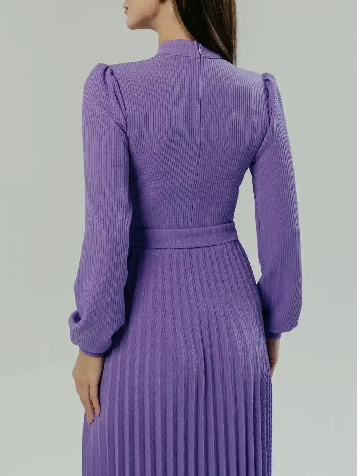 Back view of the violet Serena Midi Dress showcasing its elegant pleats and sculpted silhouette.