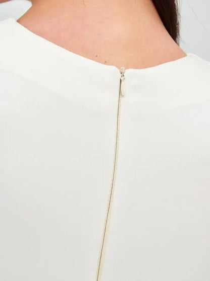 Close-up of the back zipper detail on the Ivory Sculpt Dress, showcasing its elegant design and soft fabric.