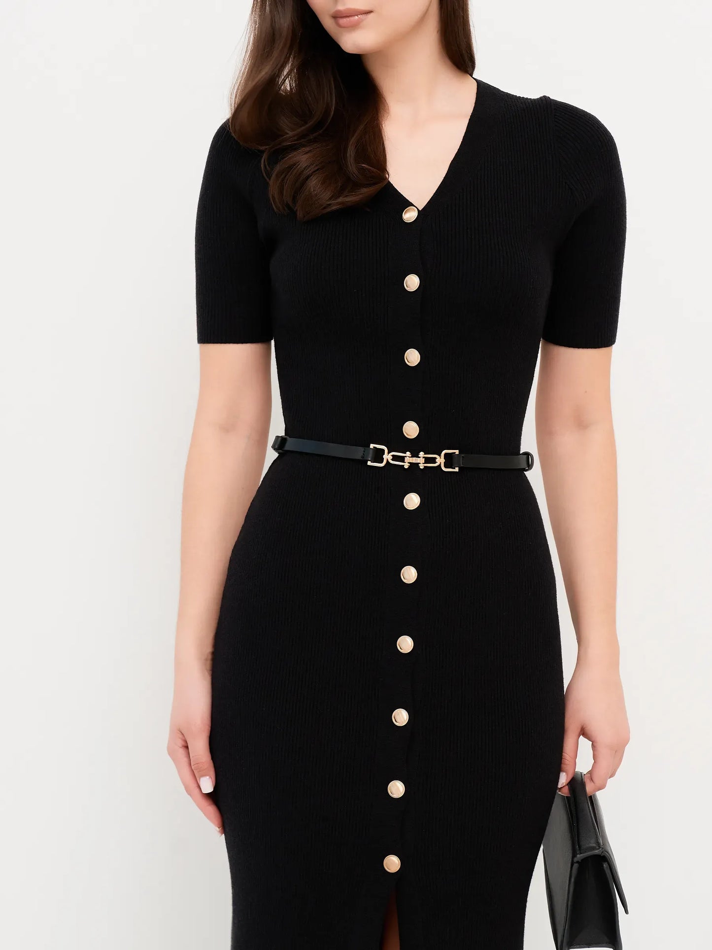 Elegant black midi dress featuring fitted rib knit, gold button details, and a belted waist for women's fashion.