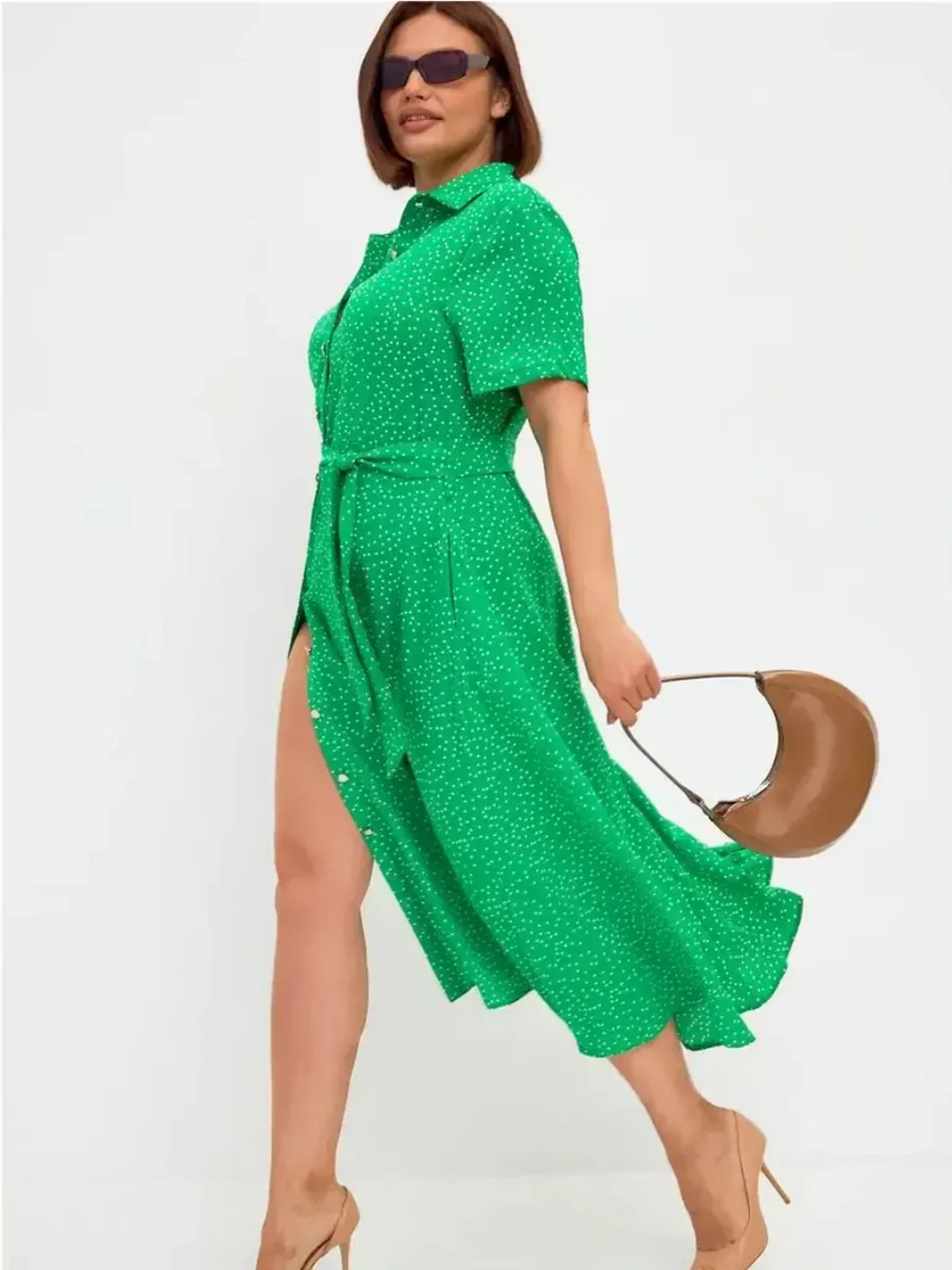 Bright green midi dress with white dots, button-down style, tie waist, ideal for summer and wedding guest attire.