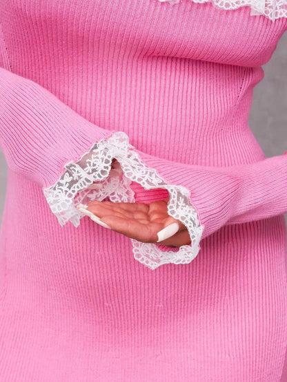Close-up of pink lace-trimmed sleeves on a mini dress, showcasing feminine style and elegance.