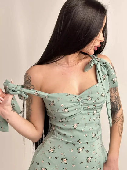 Flora Grace Midi Dress featuring romantic floral print and elegant shoulder bows, perfect for spring events and weddings.