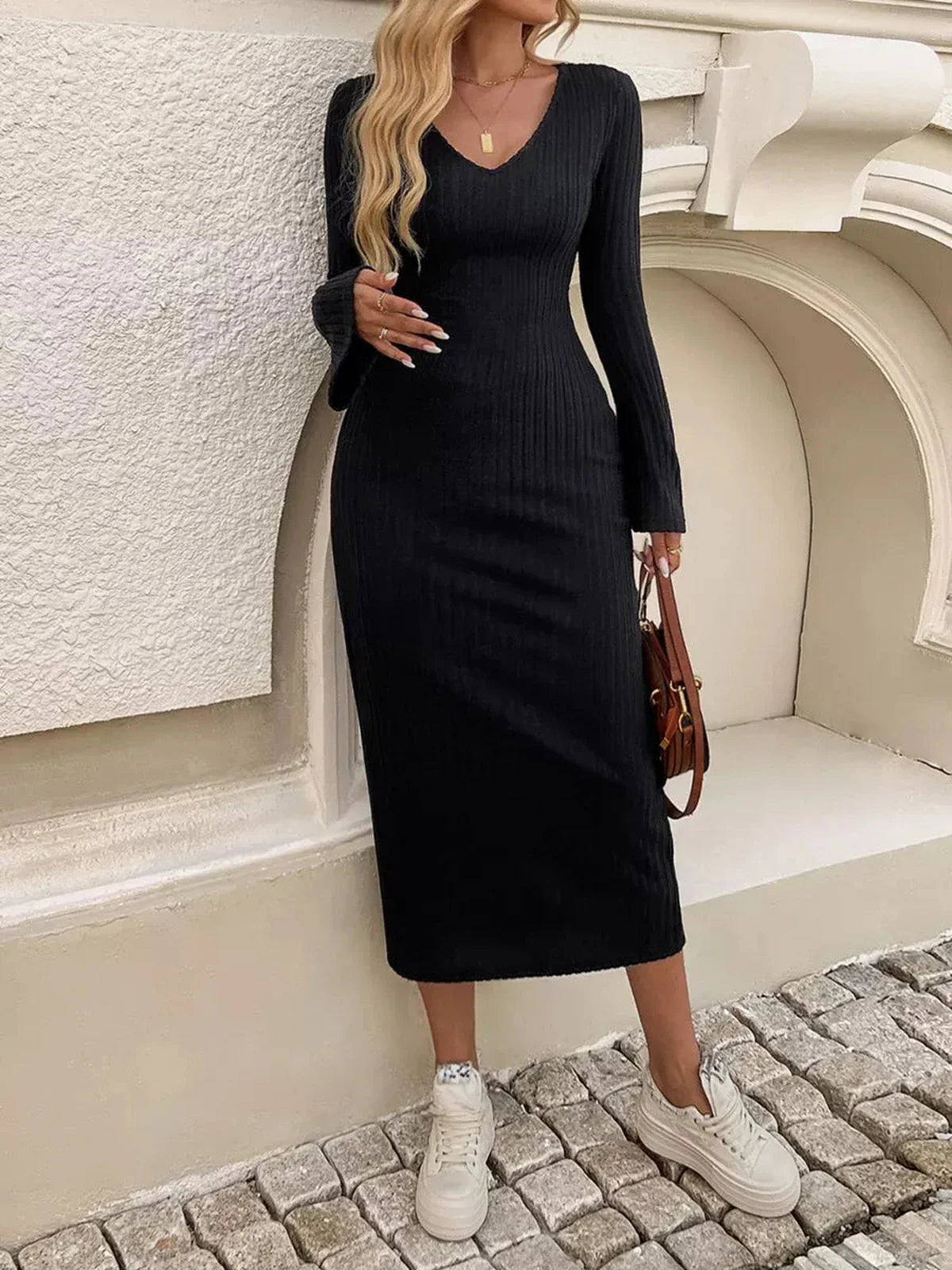 Sculpted Chic Midi Dress in black ribbed knit, featuring bell sleeves and a V-neckline, perfect for formal and casual occasions.