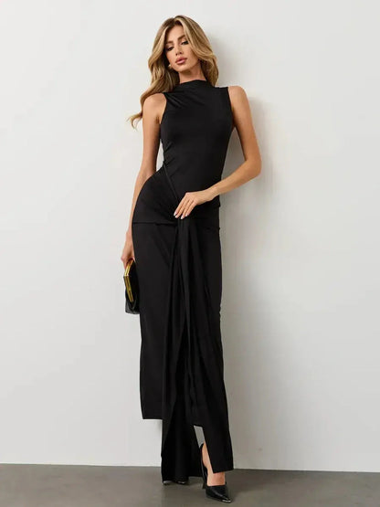 Sleek black Obsidian Drape Maxi Dress featuring a sculpted silhouette and dramatic draping, perfect for formal events.