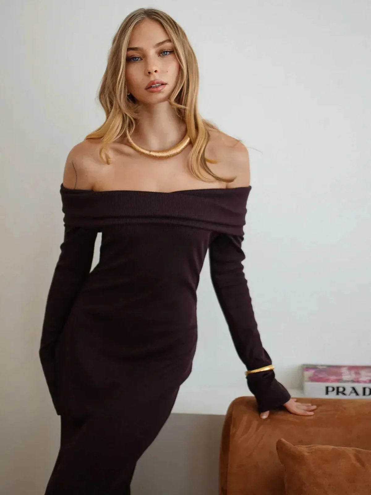 Elegant off-shoulder maxi dress in a rich hue, showcasing a chic ribbed texture and flattering silhouette.
