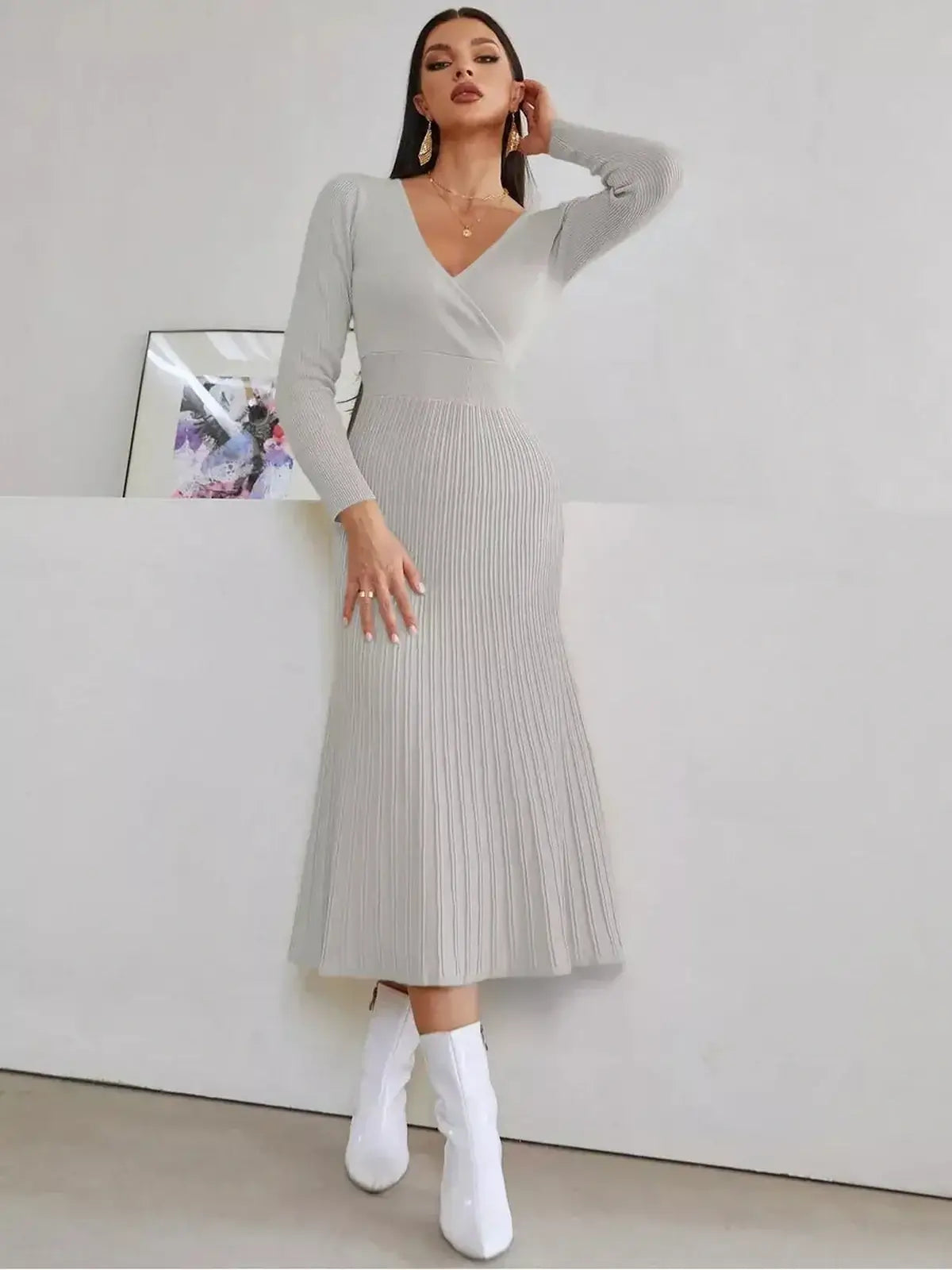 Elegant Sculpted Grace Midi Dress in soft ribbed texture, featuring a V-neckline and pleated skirt, perfect for women's formal occasions.