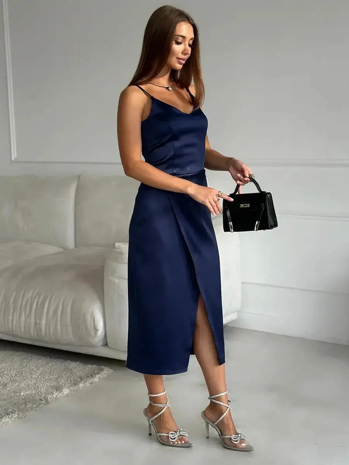Midnight Charm Midi Dress in deep navy, showcasing stylish satin fabric and elegant wrap skirt for evening events.