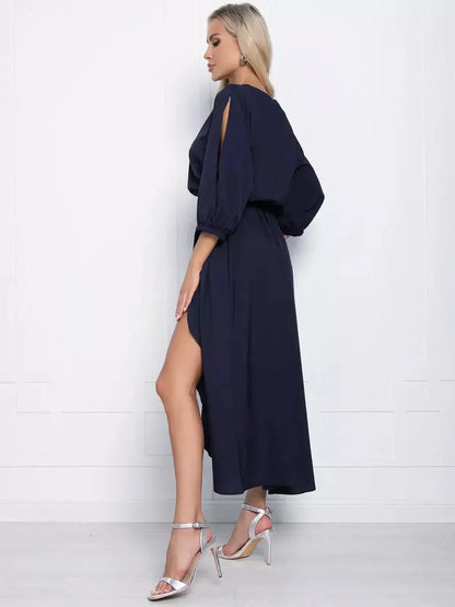 Sapphire Grace Midi Dress in navy with a flowing silhouette and slit sleeves, perfect for weddings and special occasions.
