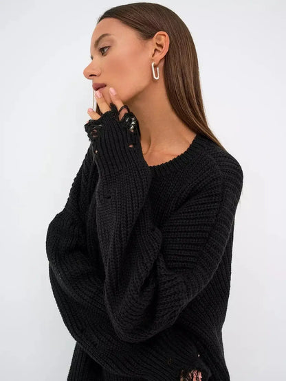 Model showcasing the Shadow Knit Mini dress in black with distressed texture and oversized fit.