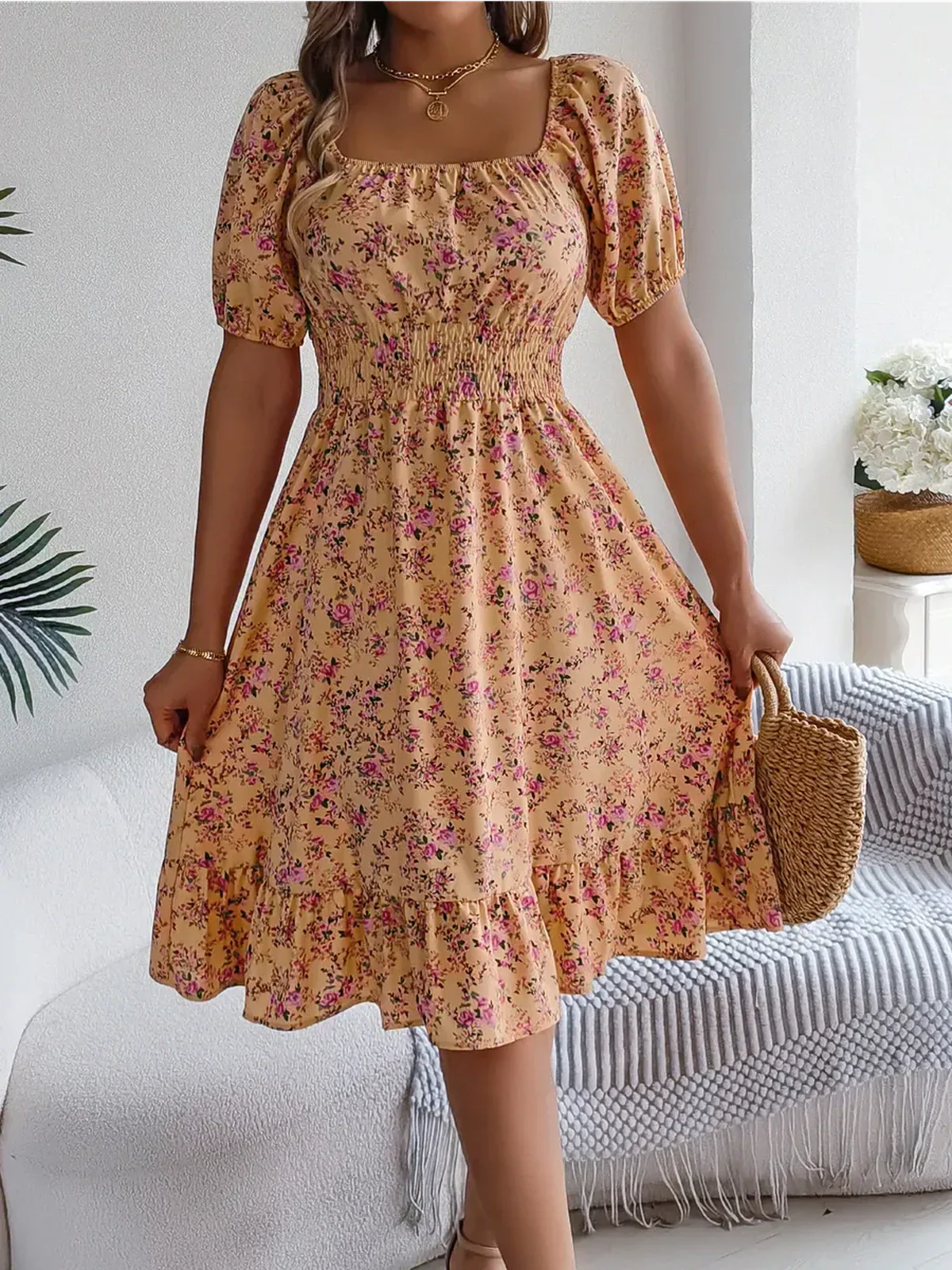 Marigold Bloom floral midi dress featuring a smocked waist, puff sleeves, and ruffle hem, ideal for summer occasions.