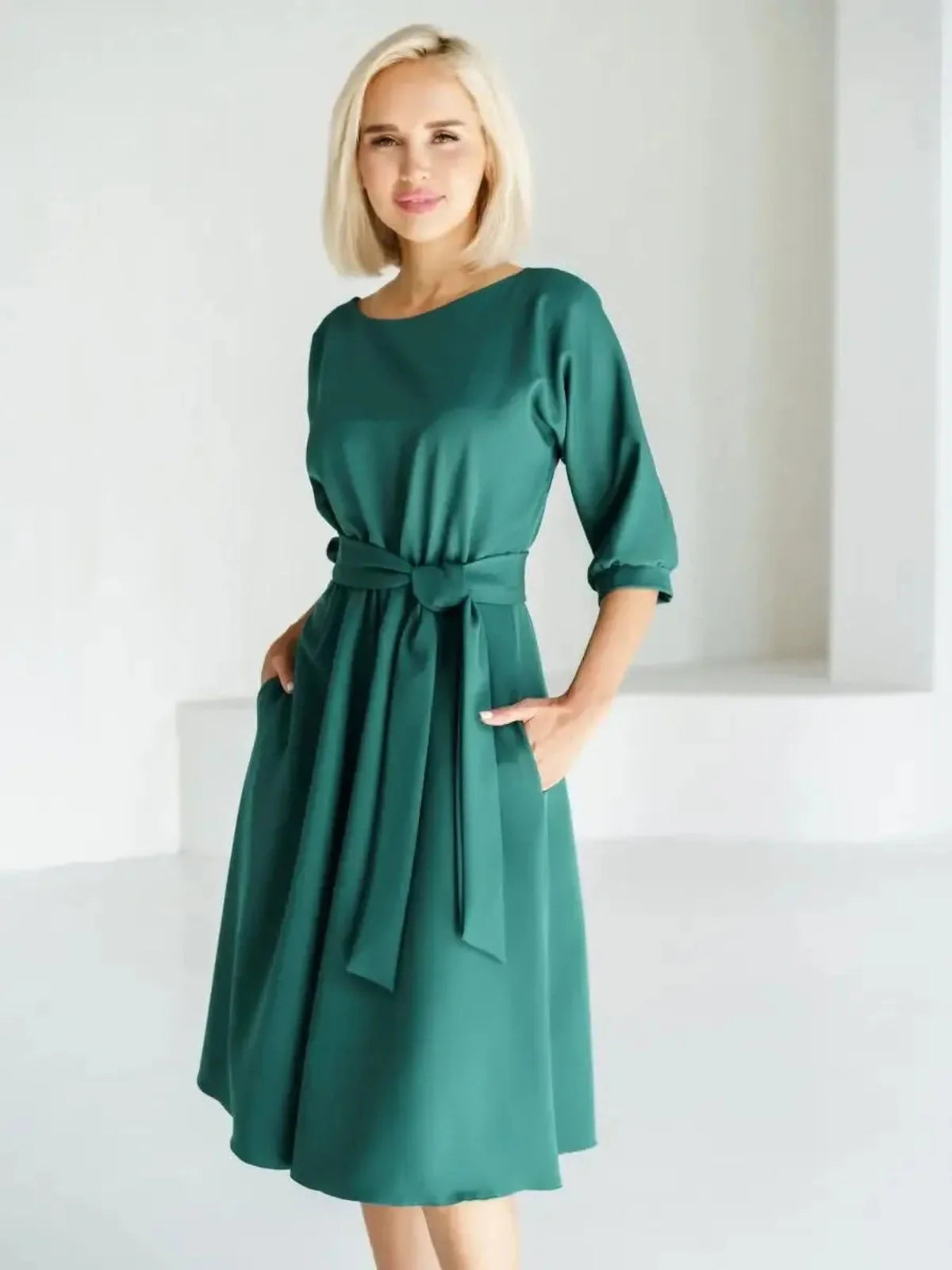 Elegant Emerald Aura Midi Dress featuring a belted waist and A-line silhouette, perfect for weddings and formal events.