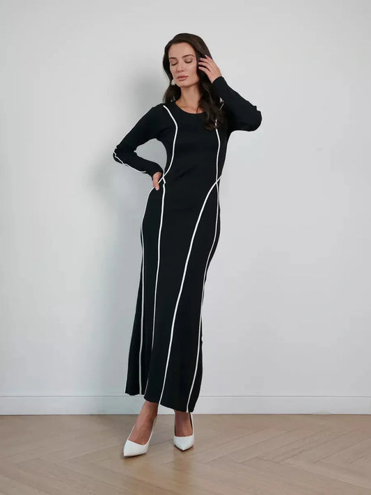 Elegant black maxi dress with white contrast piping, perfect for formal events and summer occasions.
