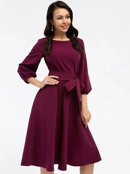 Burgundy Allure Midi Dress with balloon sleeves and self-tie belt, perfect for weddings or formal occasions.