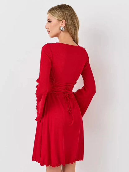 Back view of a red flare cutout mini dress with bell sleeves, perfect for summer and special occasions.