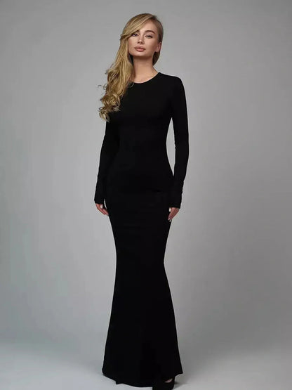 Sculpted Elegance Maxi Dress in black, featuring long sleeves and a seamless design, perfect for formal occasions.