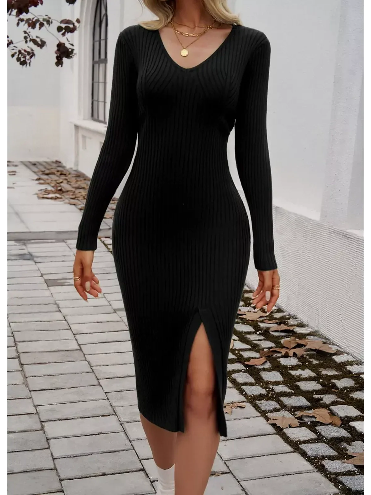 Elegant black Sculpted Grace Midi Dress in ribbed knit with a side slit, perfect for wedding guest or formal occasions.