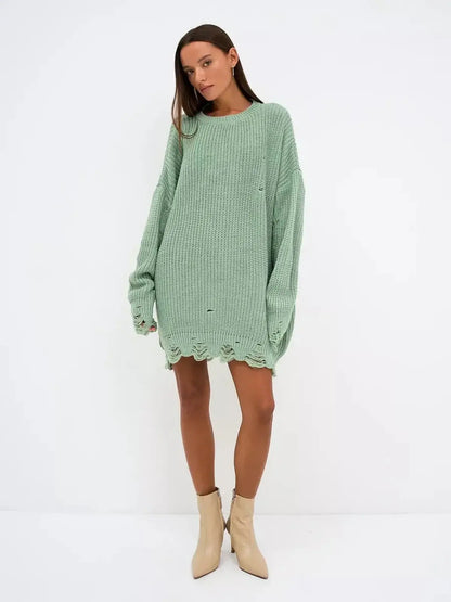 Soft mint green oversized Frost Knit Mini sweater dress with distressed accents, perfect for casual outings and summer events.