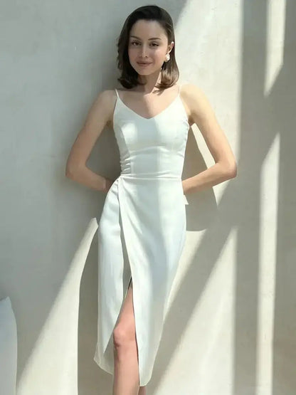 Model wearing the Opal Charm Midi Dress, an elegant ivory satin gown with a wrap slit for a chic evening look.