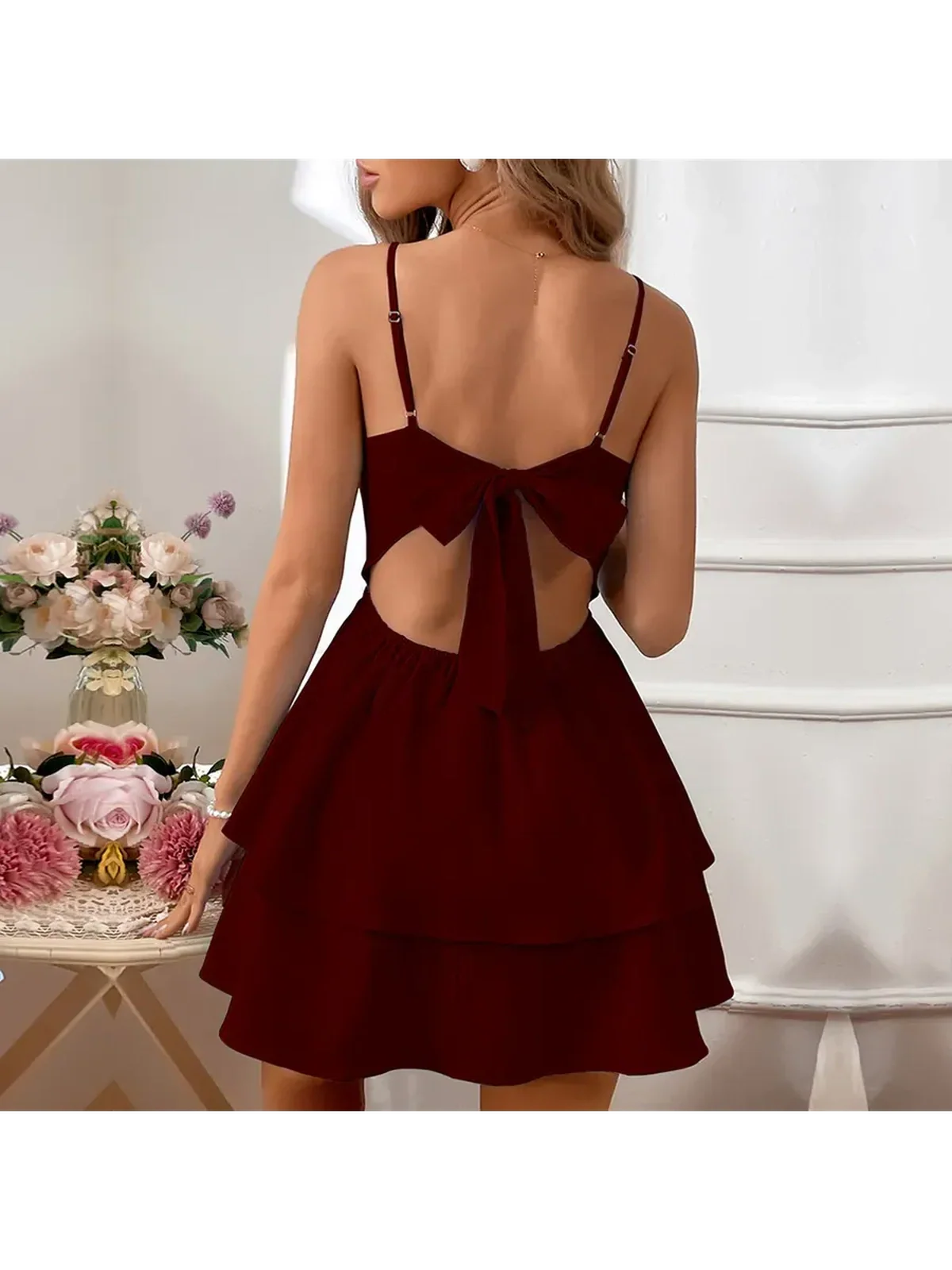 Chic maroon Tulle Bow mini dress featuring a tiered skirt and oversized back bow, perfect for weddings and graduations.