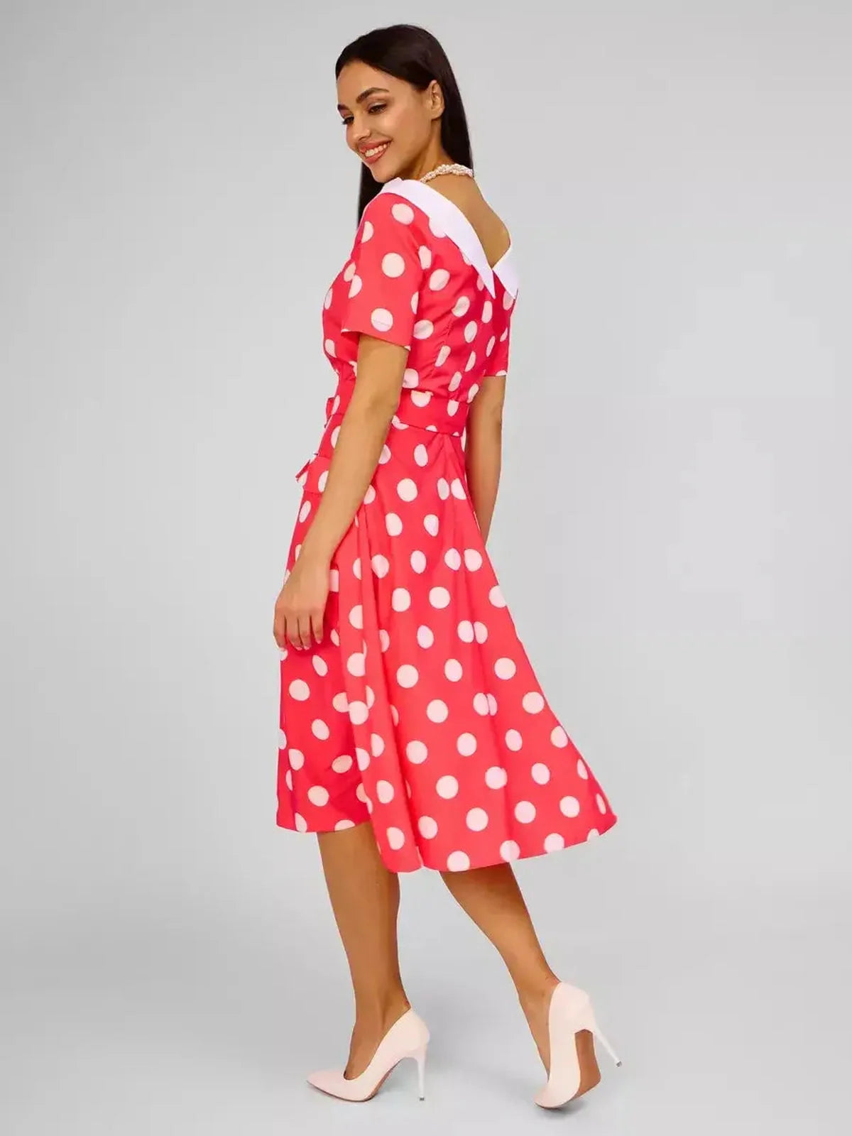 Sailor Chic Midi Dress in vibrant pink with polka dots, featuring a white sailor collar and flattering fit-and-flare silhouette.