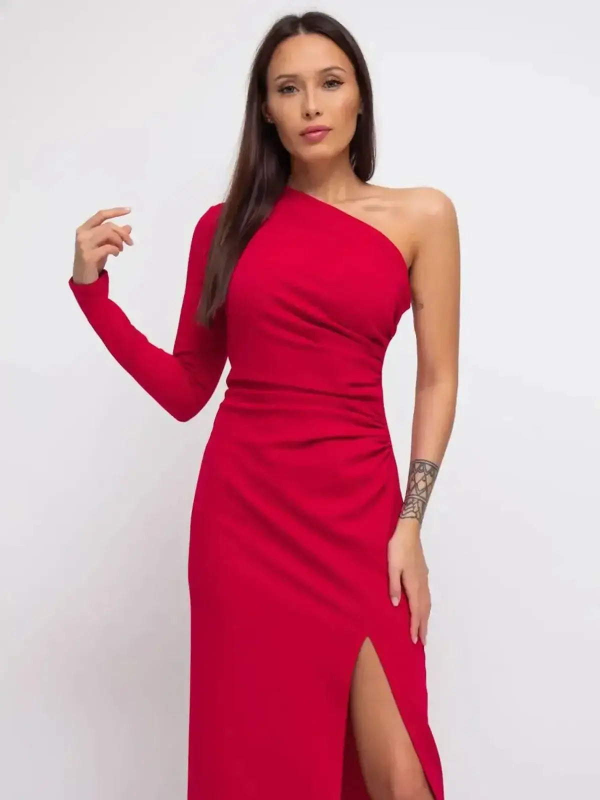 Striking red one-shoulder maxi dress with elegant slit, perfect for formal occasions and special events.