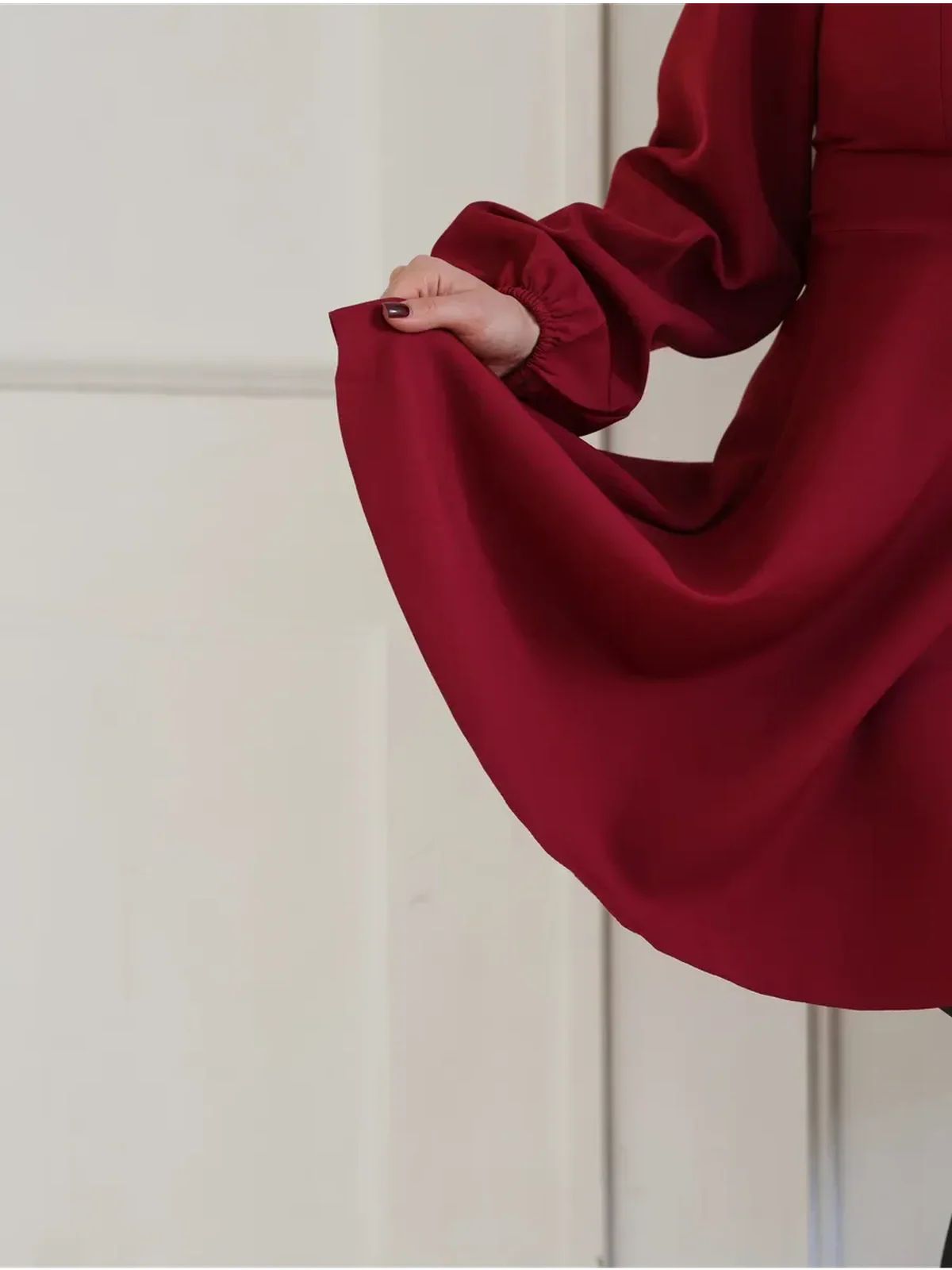 Elegant Ruby Flare red dress with flared skirt and statement sleeves, perfect for weddings, parties, or special occasions.