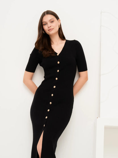 Elegant black midi dress with gold button detail and fitted rib knit, perfect for formal occasions and summer events.