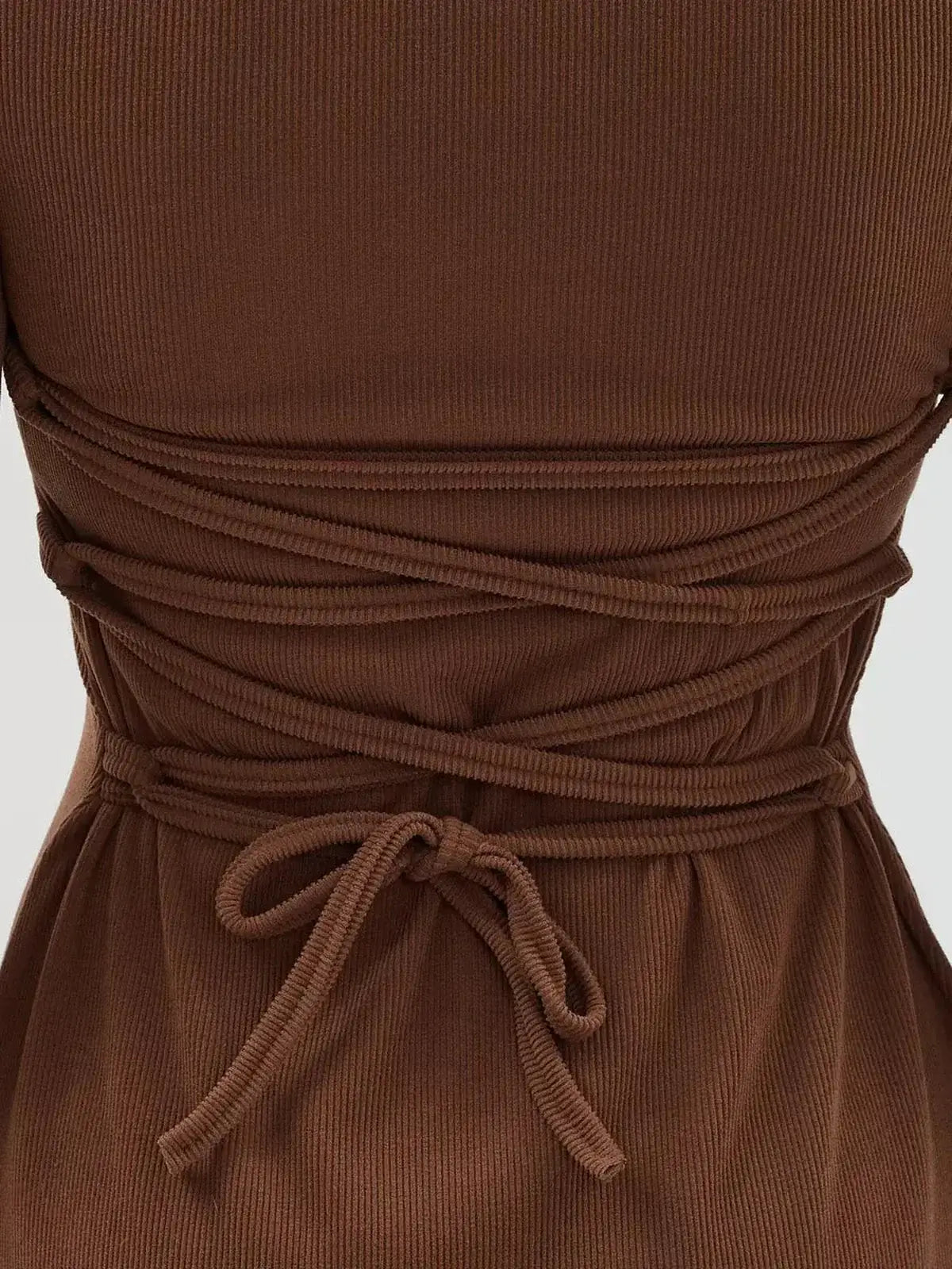 Cocoa Tie Mini Dress back lace detail showcasing a stylish, sculpting knit design and adjustable tie for a flattering fit.