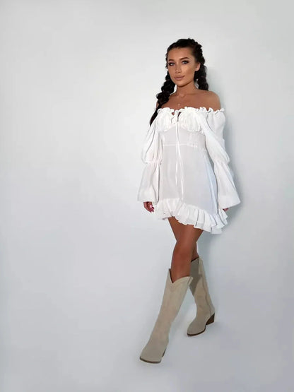 Elegant off-shoulder Ruffle Bloom Mini Dress in white, featuring voluminous sleeves and flirty ruffles, perfect for summer.