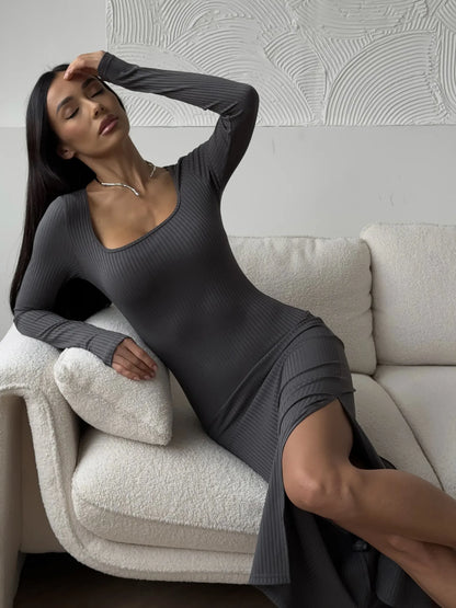 Model in a sleek Sculpted Grace Midi Dress, showcasing a flattering square neckline and thigh-high slit.