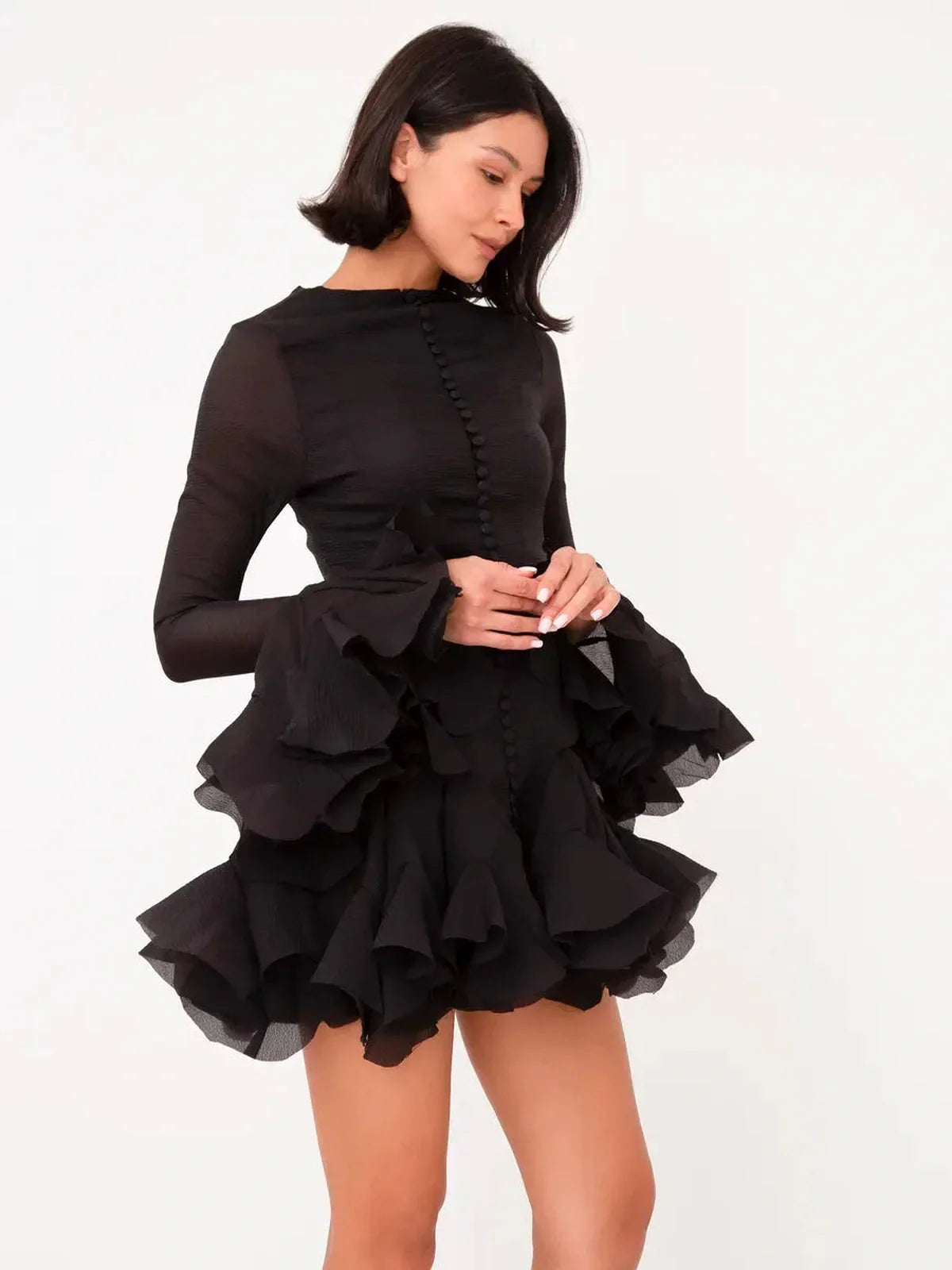 Black chiffon mini dress with ruffle flare hem and bell sleeves, perfect for weddings and formal occasions.