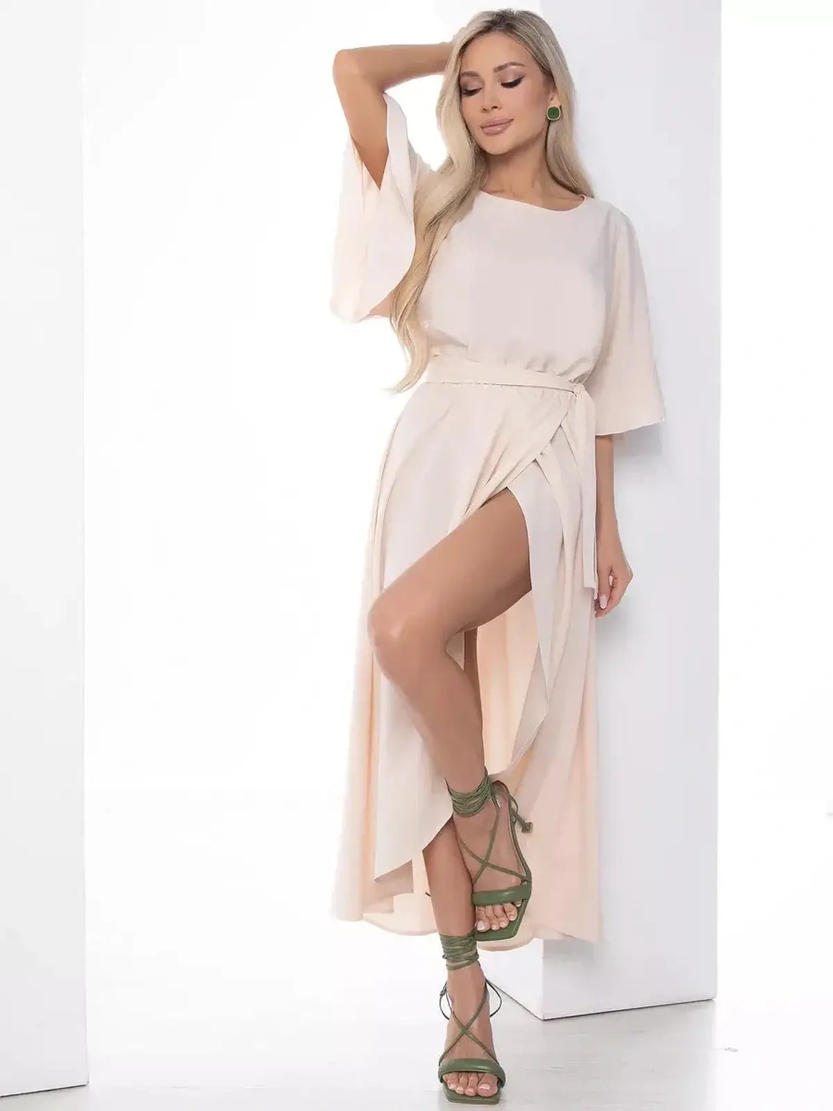 Serenity Midi Dress with flared sleeves and side slit, ideal for weddings and summer occasions, offering a fluid feminine silhouette.