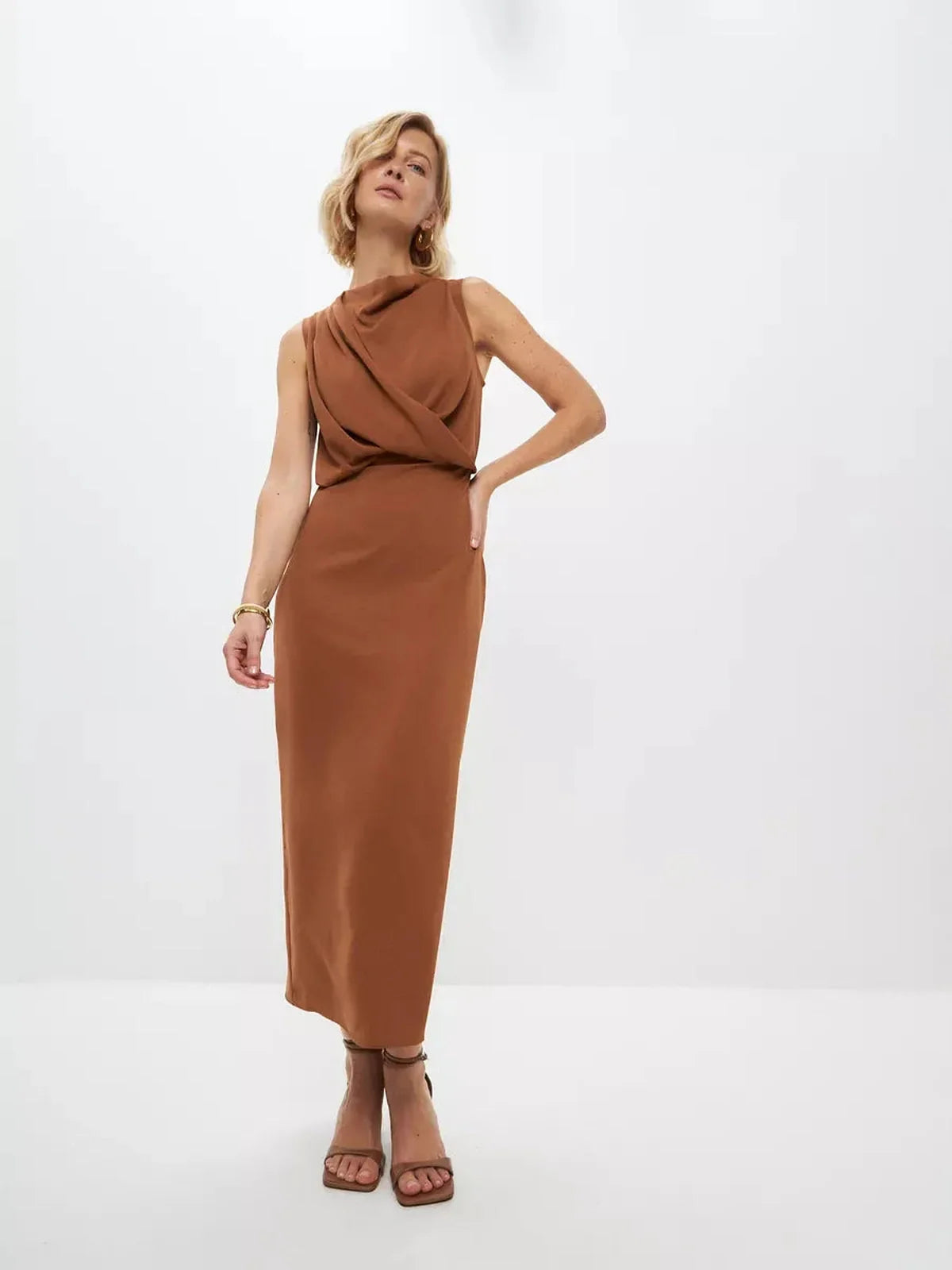 Sculpted Drape Maxi Dress in warm light brown, showcasing fluid draping and elegant silhouette, ideal for formal occasions.