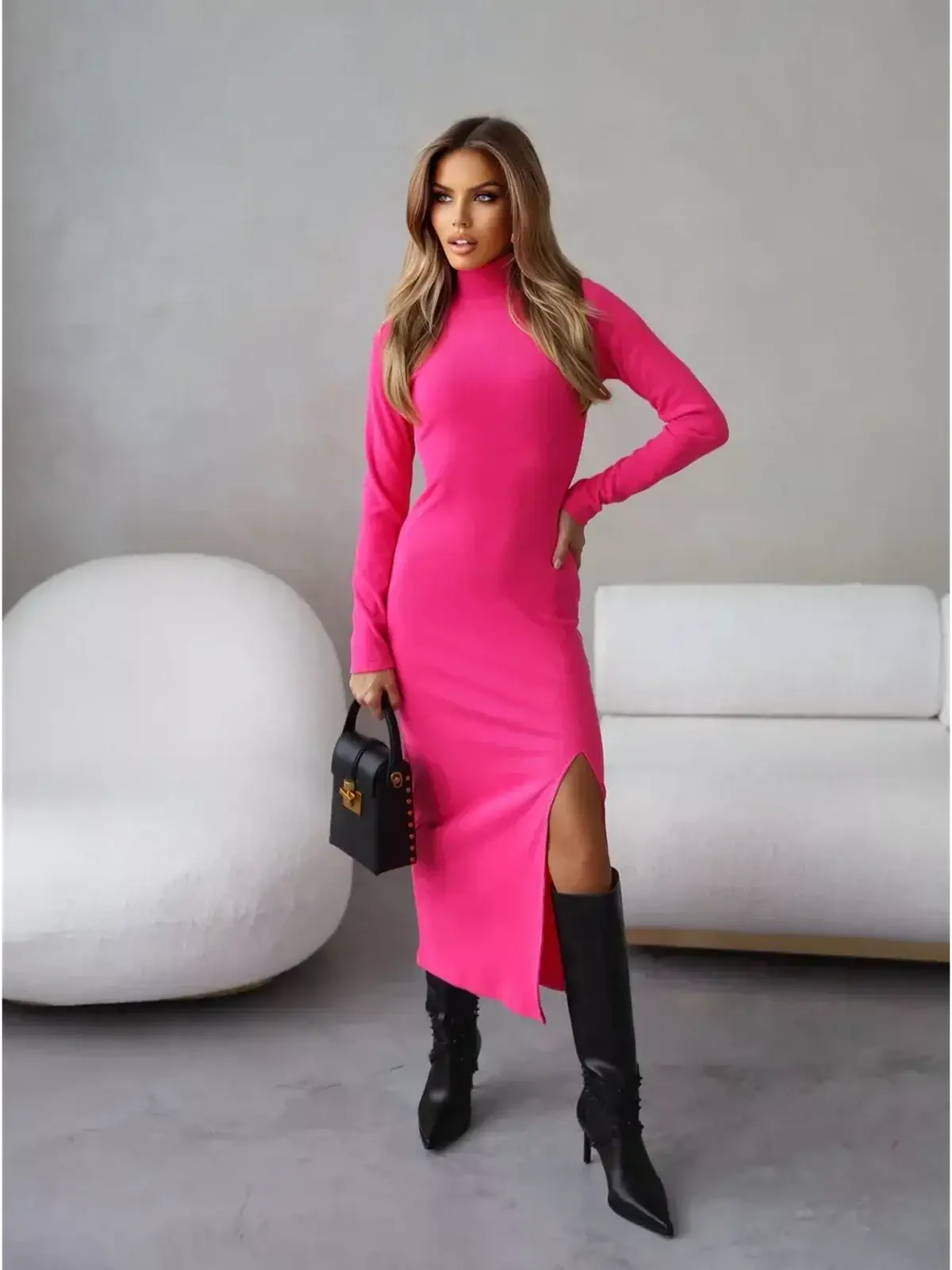 Elegant fuchsia midi dress with high neckline and thigh-high slit, styled for a chic look.