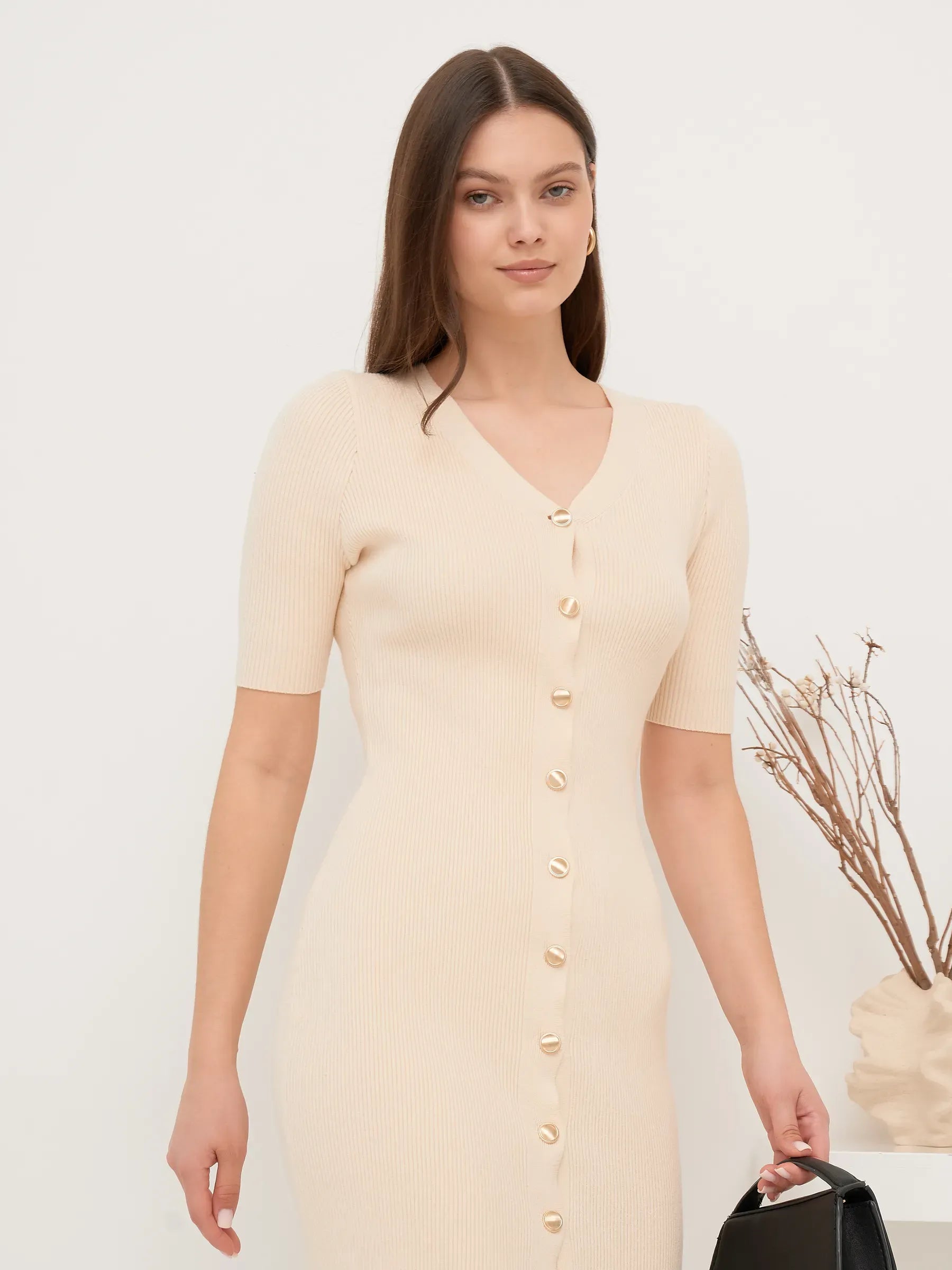 Pearl Knit Midi Dress featuring a fitted silhouette and V-neckline, adorned with gold-toned buttons, perfect for elegant occasions.