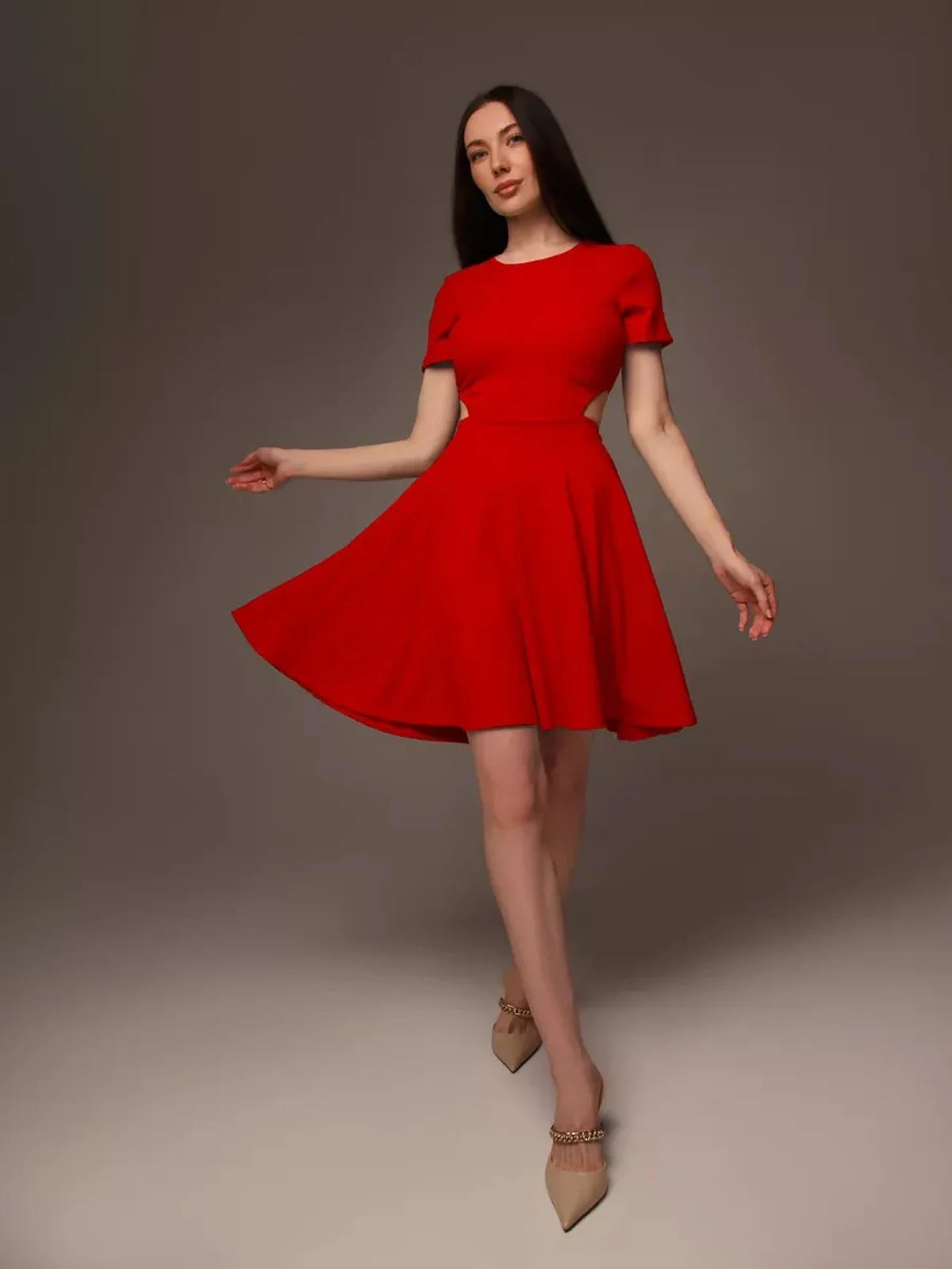 Elegant woman in a red flare cutout mini dress, perfect for summer gatherings, weddings, and cocktail events.