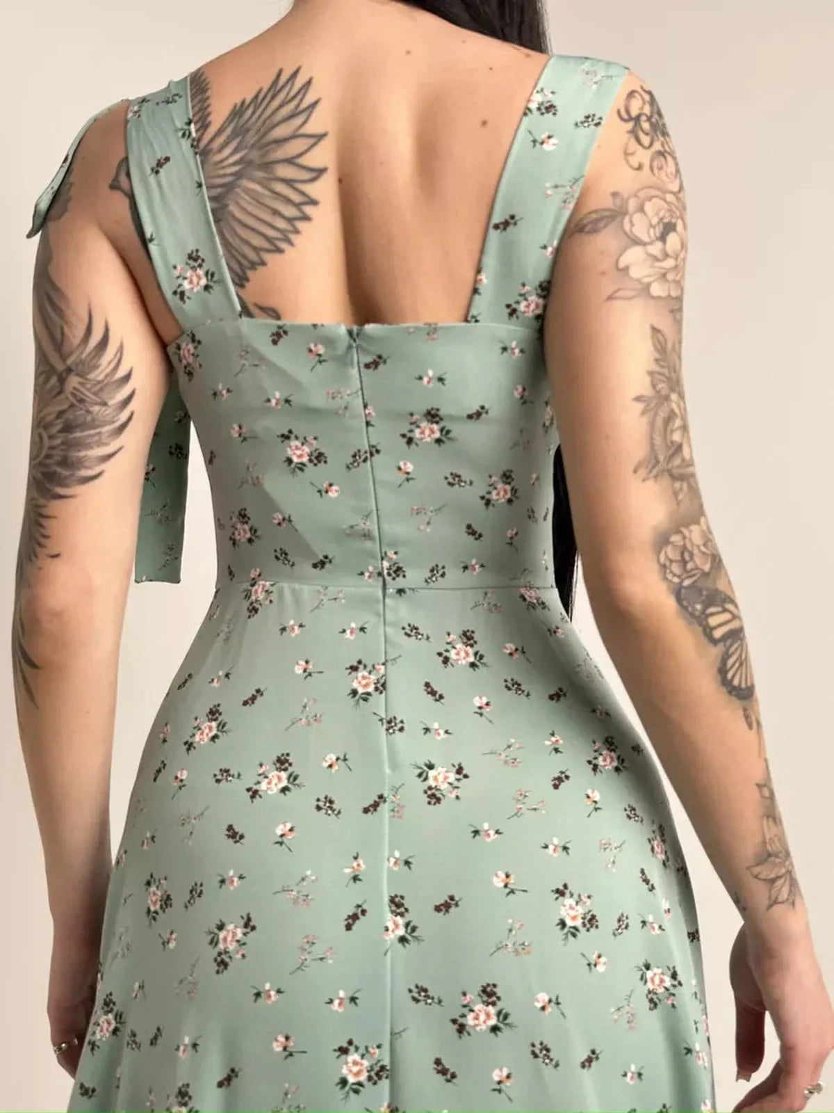 Back view of the Flora Grace Midi Dress showcasing floral print and elegant shoulder ties, perfect for wedding guest or spring events.