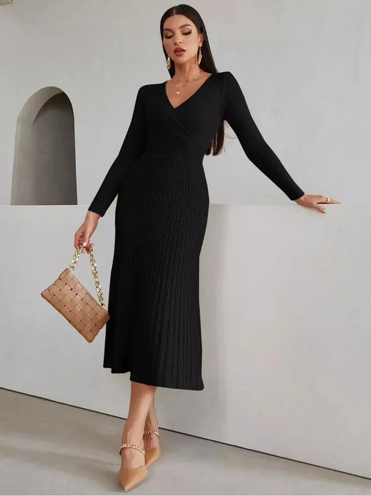 Elegant black midi dress with ribbed texture, long sleeves, and a fitted silhouette, perfect for formal occasions.