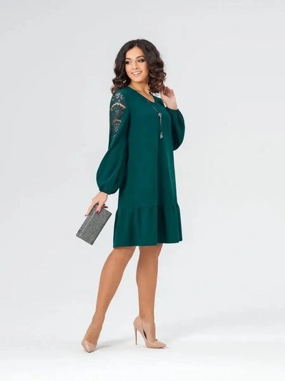 Elegant green mini dress with lace sleeves, perfect for weddings, parties, or formal occasions.