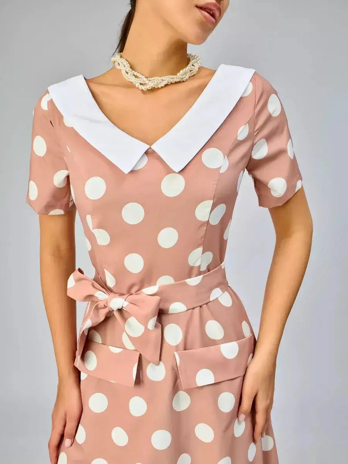 Vintage Muse Midi Dress with polka dots and white collar, perfect for summer events and casual outings.