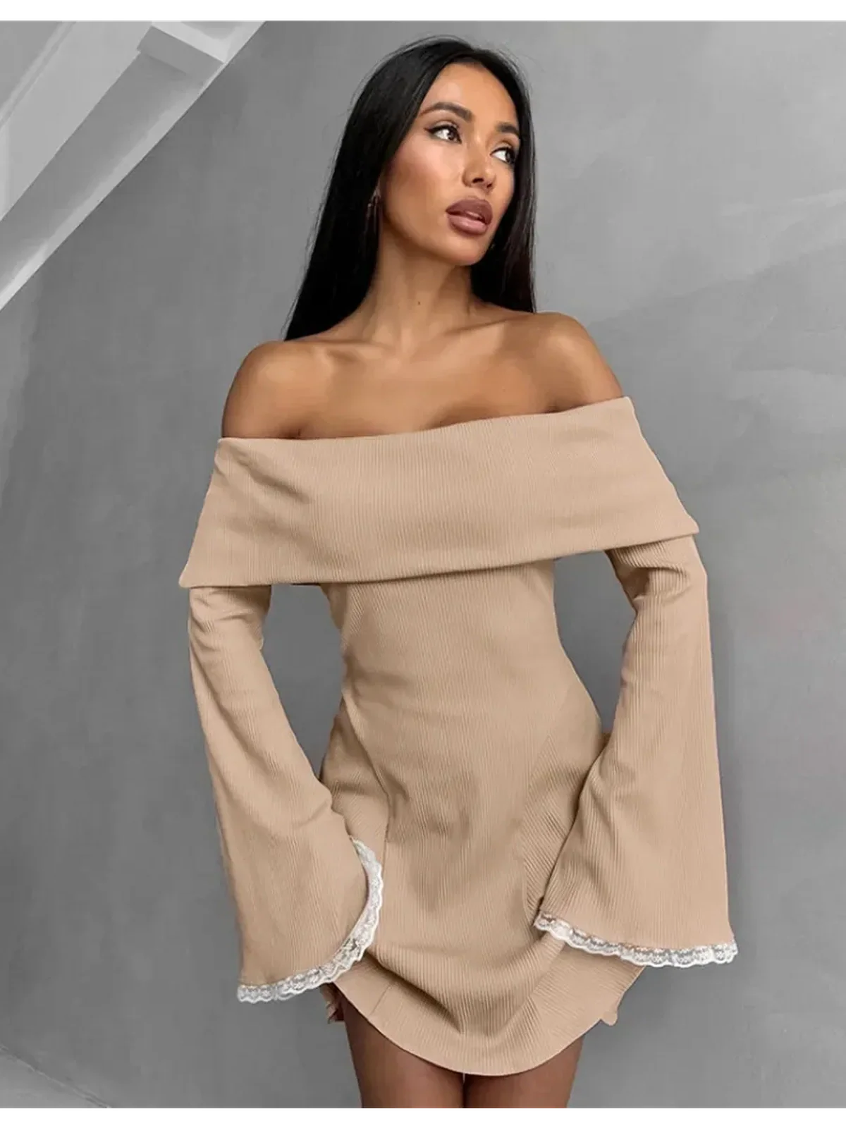 Muse Mini Dress in beige with off-shoulder design, flared lace-trimmed sleeves, perfect for summer or wedding guest attire.