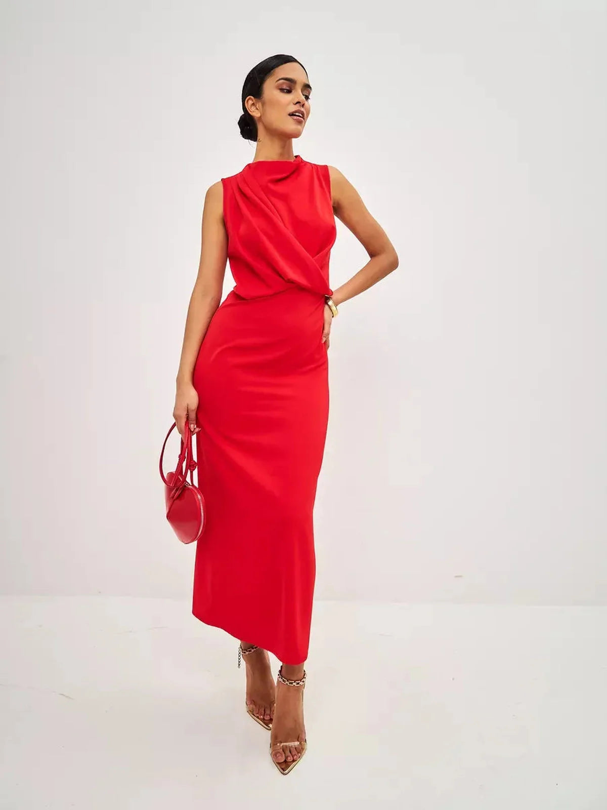 Stylish woman in a red drape maxi dress, perfect for wedding guest and formal occasions.