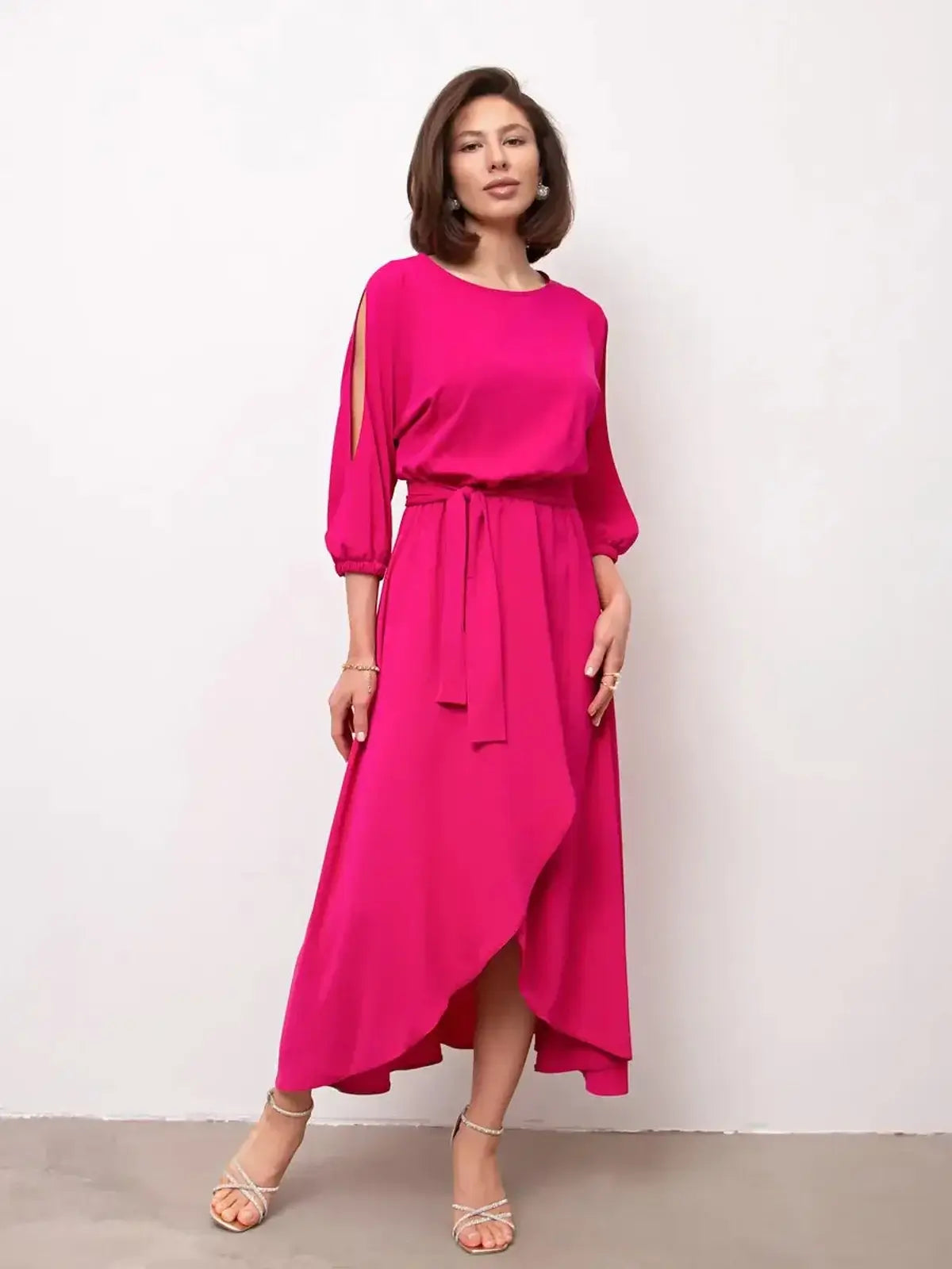 Twilight Bloom Midi Dress in radiant fuchsia with shoulder cutouts and a high-low hemline, perfect for weddings and events.