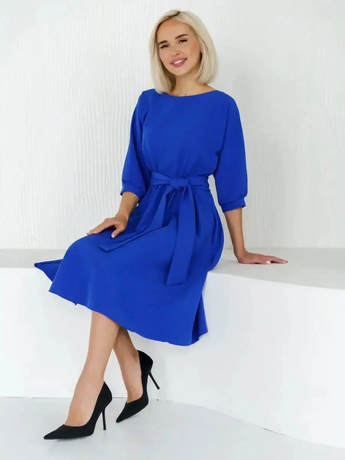 Sapphire Belted Midi Dress in electric blue, perfect for weddings, proms, and formal occasions, styled with heels.