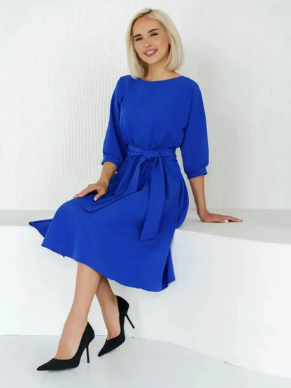 Sapphire Belted Midi Dress in electric blue, perfect for weddings, proms, and formal occasions, styled with heels.